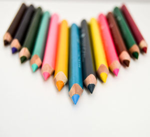 Close-up of colored pencils on table