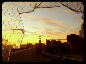 Cityscape against sky during sunset