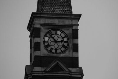 Low angle view of clock tower against sky