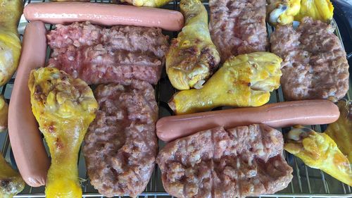 High angle view of meat on barbecue