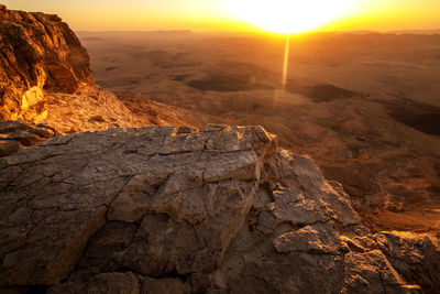 Scenic view of rocky mountains during sunset