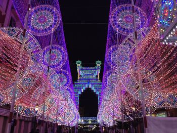 Low angle view of illuminated building at night