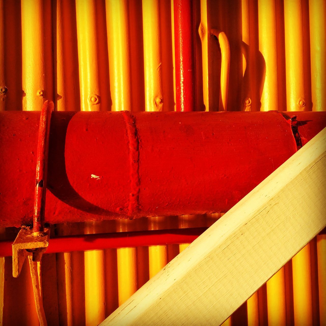 indoors, red, in a row, multi colored, side by side, yellow, order, close-up, still life, variation, no people, arrangement, choice, large group of objects, shelf, wood - material, orange color, metal, abundance, hanging
