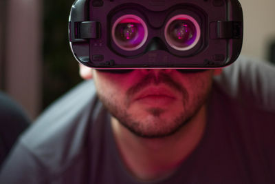 Close-up of man using virtual reality simulator