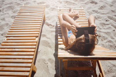 High angle view of woman sitting on chair