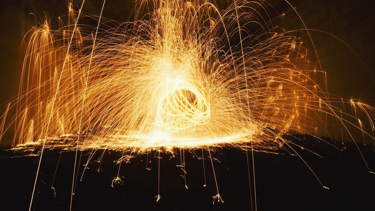 night, illuminated, long exposure, motion, glowing, sparks, celebration, firework display, arts culture and entertainment, fire - natural phenomenon, event, exploding, firework - man made object, blurred motion, burning, firework, spinning, entertainment, light painting, wire wool