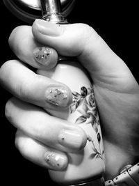 Close-up of woman holding hands