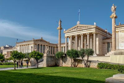 Low angle view of historic buildings against blue sky