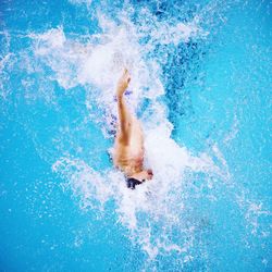 Man swimming in pool