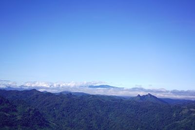 Scenic view of mountains against clear blue sky