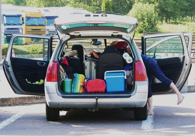 Luggage in car on street