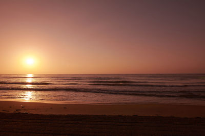 Sunrise on lonely beach, orange filter, sunny, lonely, sand