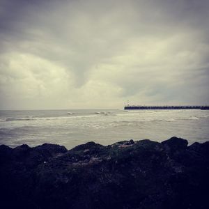 Scenic view of sea against cloudy sky