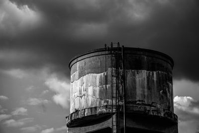 Low angle view of abandoned factory against sky