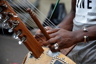 Close-up of man playing musical instrument