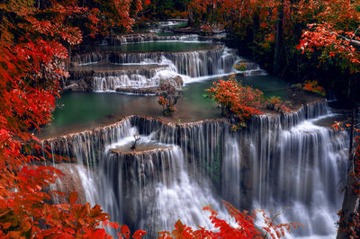 Scenic view of waterfall in forest during autumn