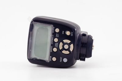 Close-up of camera against white background