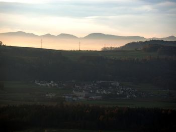 Scenic view of landscape against sky during sunset