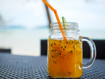 Close-up of drink in glass jar on table