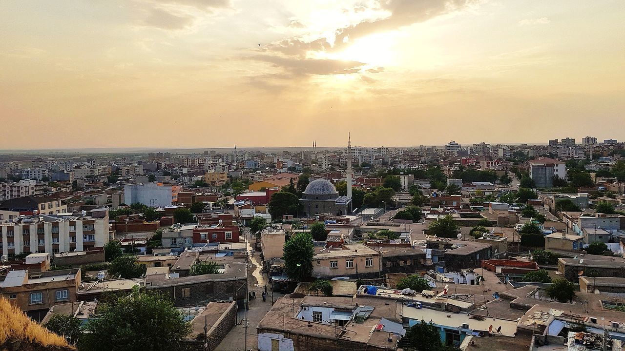 CITYSCAPE AGAINST SKY DURING SUNSET