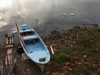 High angle view of boat moored at lakeshore