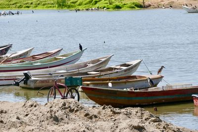 Boats moored in lake