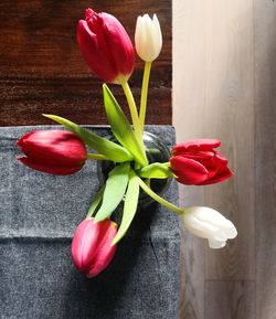 Close-up of red tulips in vase on table