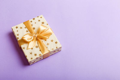 High angle view of gift box against blue background