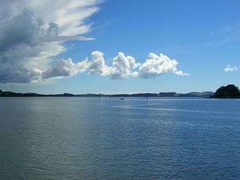 Scenic view of calm sea against cloudy sky