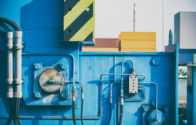 Close-up of pipes against wall