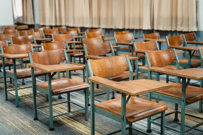 Empty chairs and table in classroom