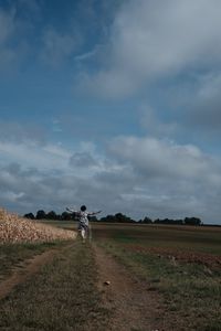 Scenic view of agricultural field against sky