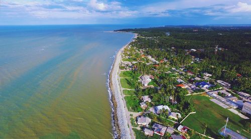 Aerial view of sea by city