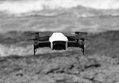 Close-up of airplane flying over land