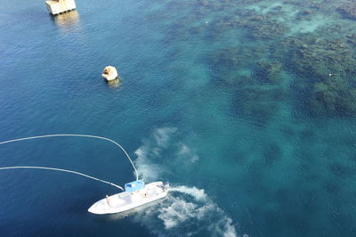 High angle view of motorboat in sea at roatan island