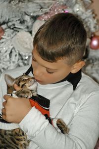 Side view of cute girl with cat