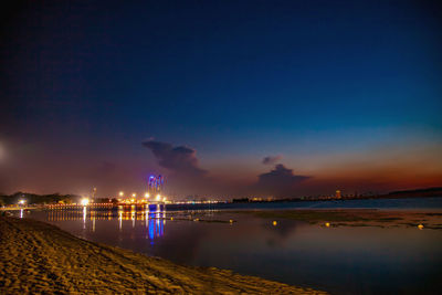 Scenic view of sea against sky at night