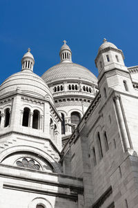 Low angle view of a building against blue sky