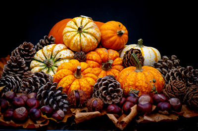 Close-up of pumpkins against black background