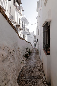 Narrow alley amidst buildings in city