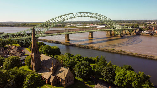 Bridge over river against sky