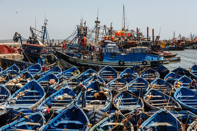 Boats moored at harbor