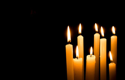 Candles on black background