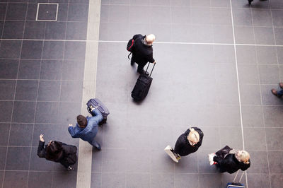 High angle view of people walking on footpath