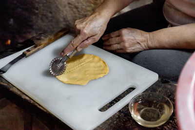 High angle view of man preparing food at table