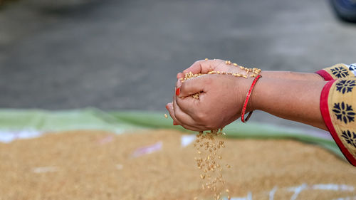 Close-up of woman hand over blurred background