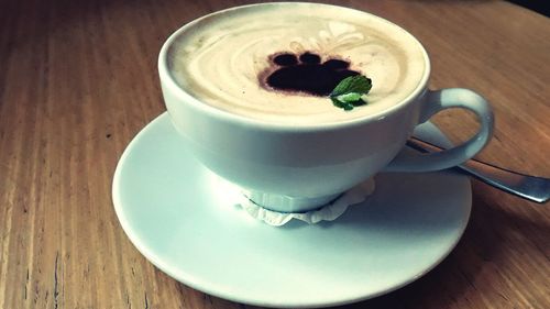 Close-up of coffee cup on table