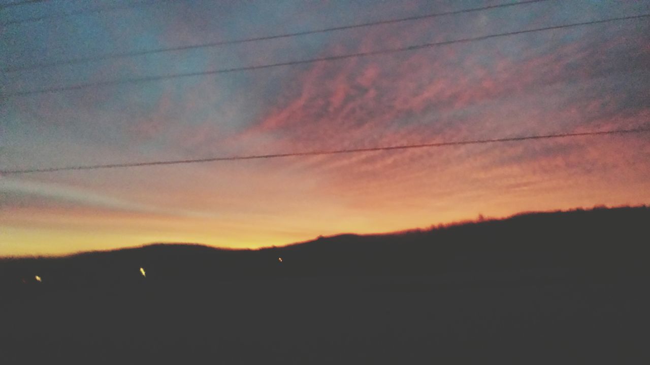 sunset, silhouette, sky, scenics, beauty in nature, tranquility, tranquil scene, orange color, cloud - sky, nature, idyllic, dramatic sky, cloud, landscape, dusk, dark, power line, outdoors, no people, cloudy