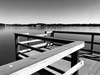 Pier on lake against sky