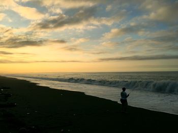 Silhouette of people on beach